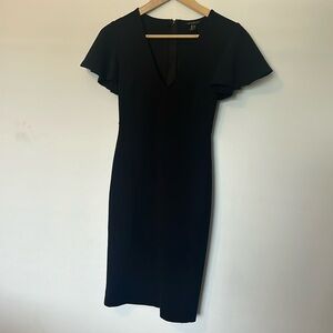 Form fitting black dress with frill sleeve